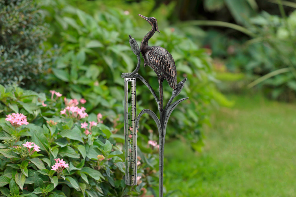 Metal heron and cattails rain watcher 