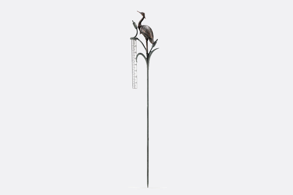 Metal heron and cattails rain watcher