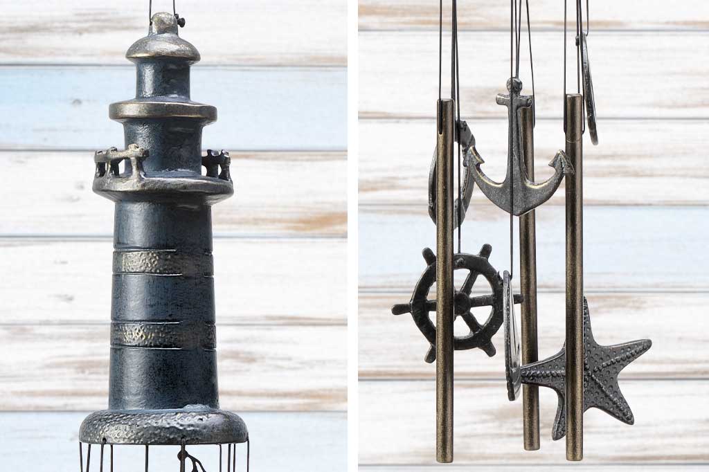 close up details on lighthouse wind chime; nautical theme hanging pendants: life ring, anchor, sailboat, ship wheel, seastar
