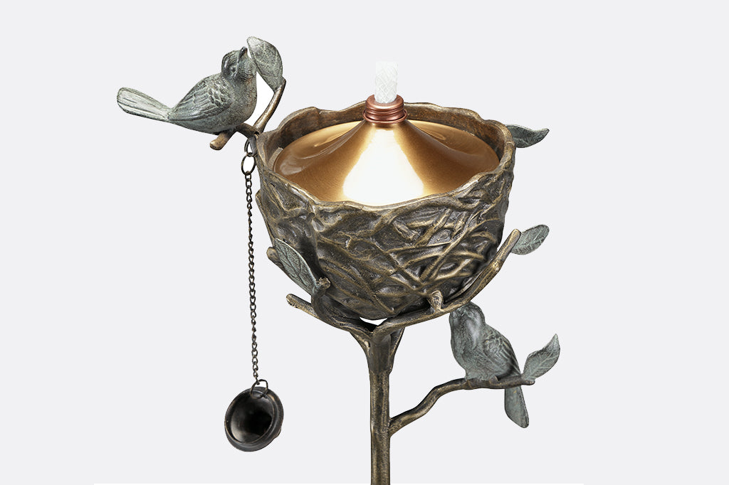 Bird's Nest cast metal Oil Torch with view of oil resevoir