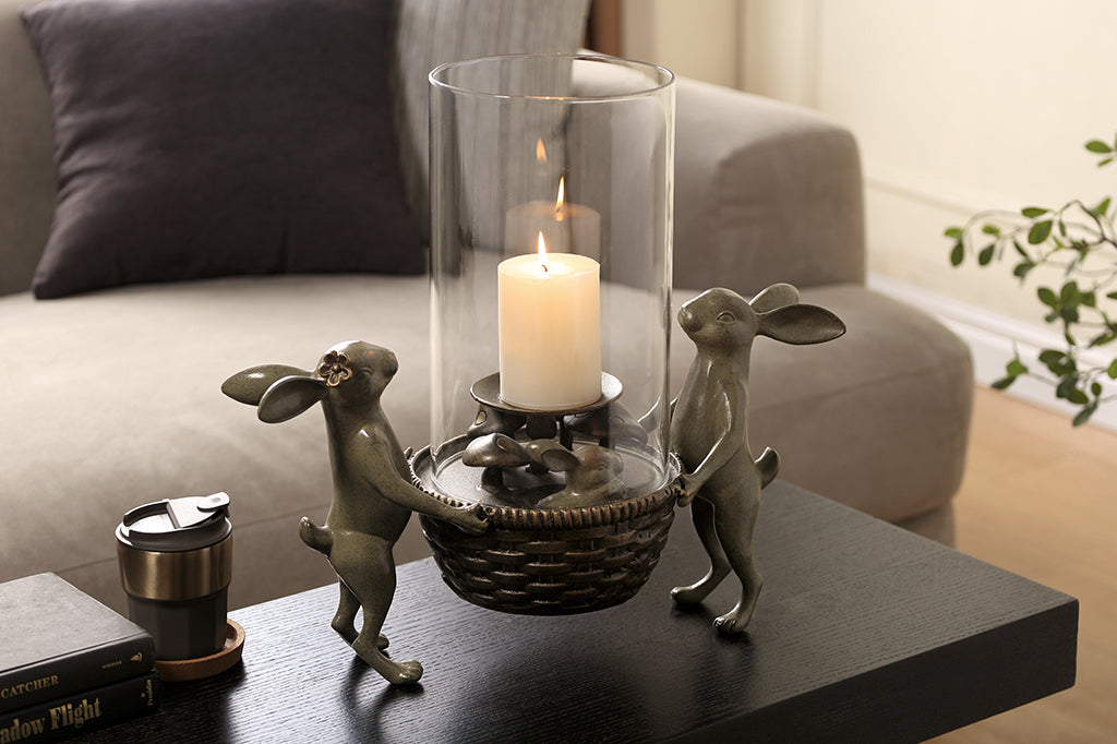 bunny candle holder set in living room scene styled on coffee table