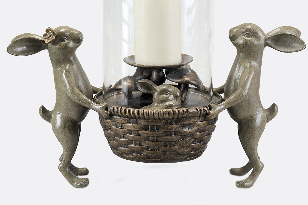 Close up view of small bunny and mushroom detail under candle platform.