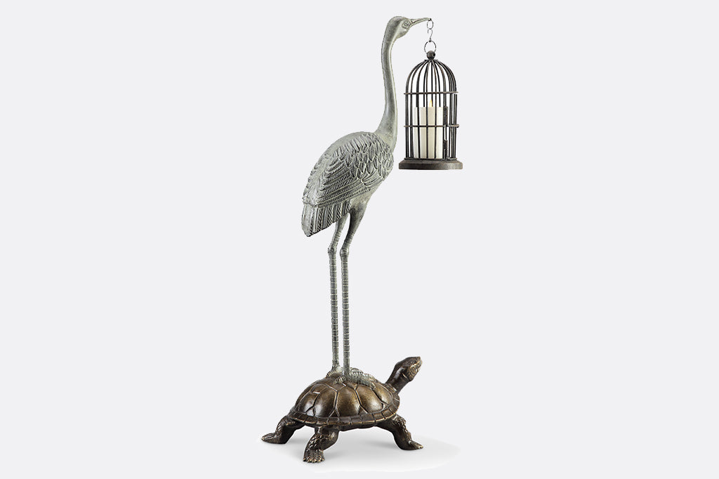 crane and turtle large sculpture; crane holding candle lantern