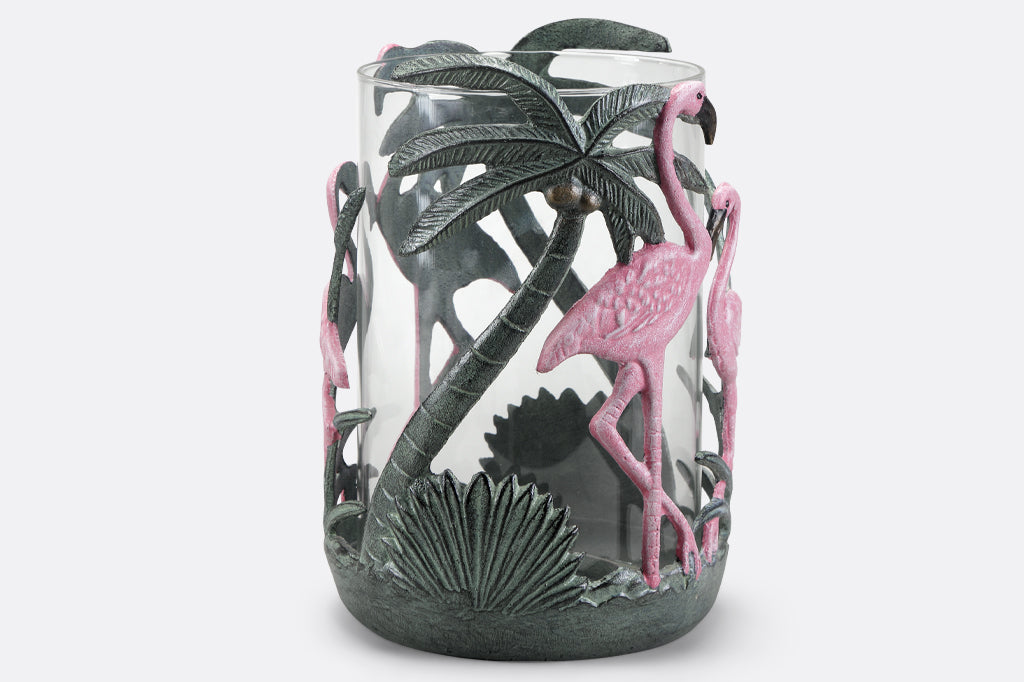 Pink flamingo candleholder with palm leaves and palm tree