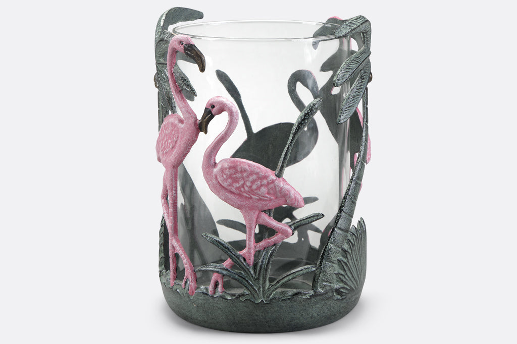 Pink flamingo candleholder with palm leaves and palm tree