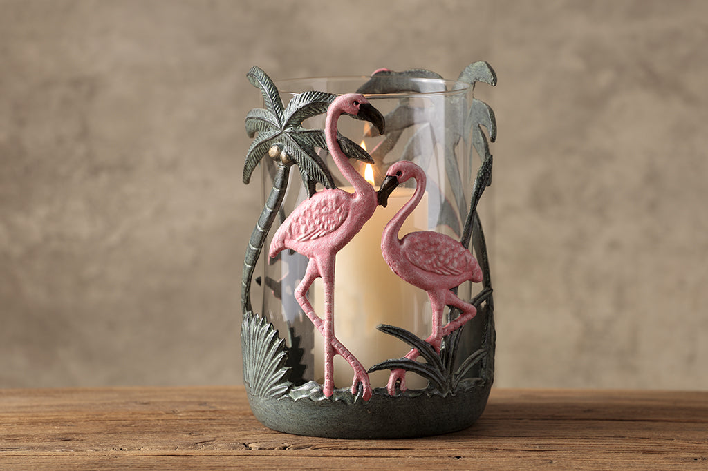 Pink flamingo candleholder with palm leaves and palm tree