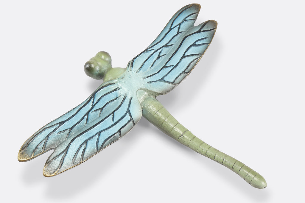 top view of the blue and green finish on a cast metal dragonfly garden sculpture
