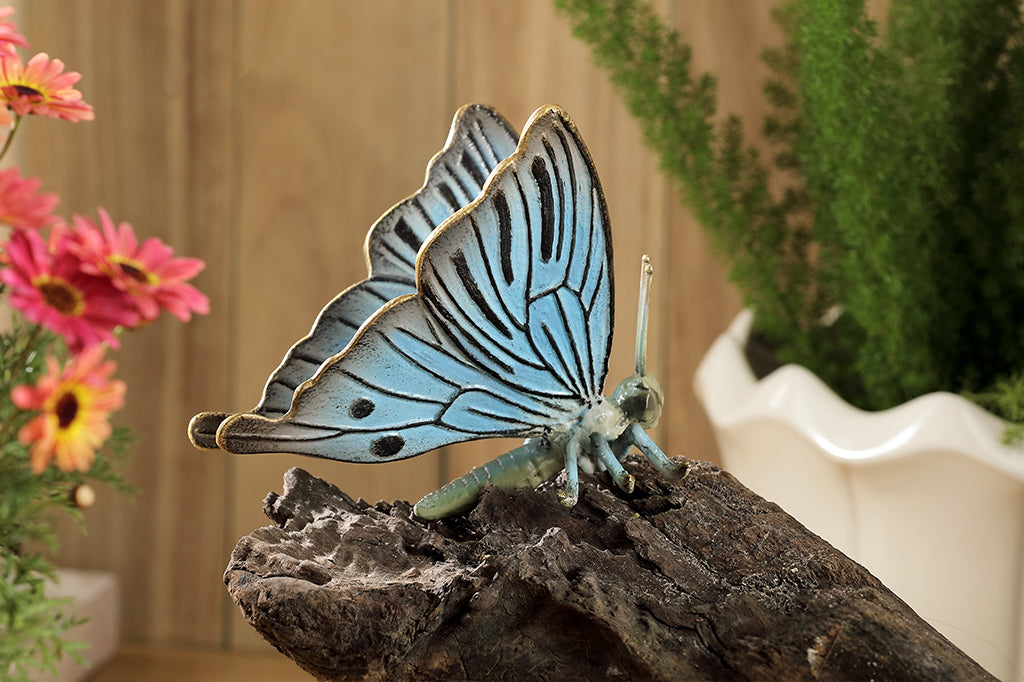 blue butterfly garden sculpture set on rock