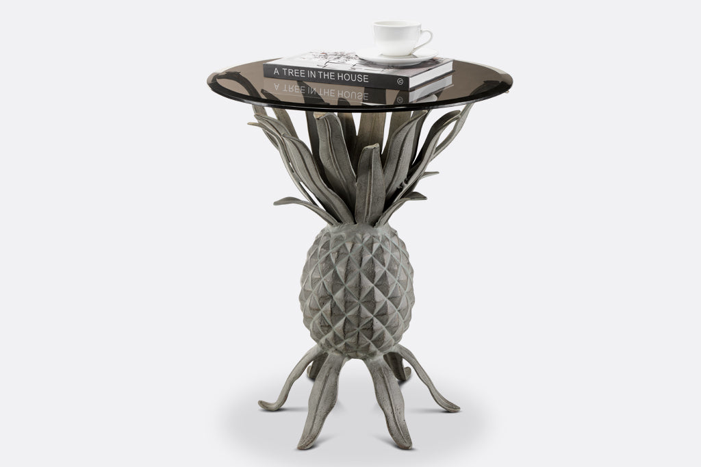 Metal pineapple accent table with gray smoked glass