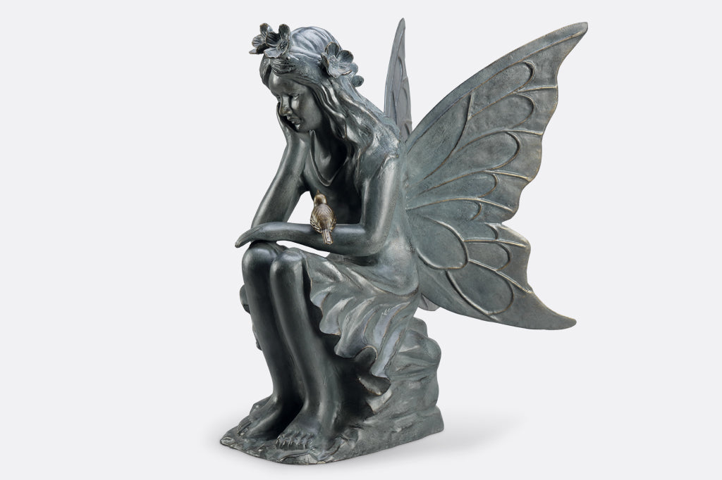 seated fairy garden sculpture face left