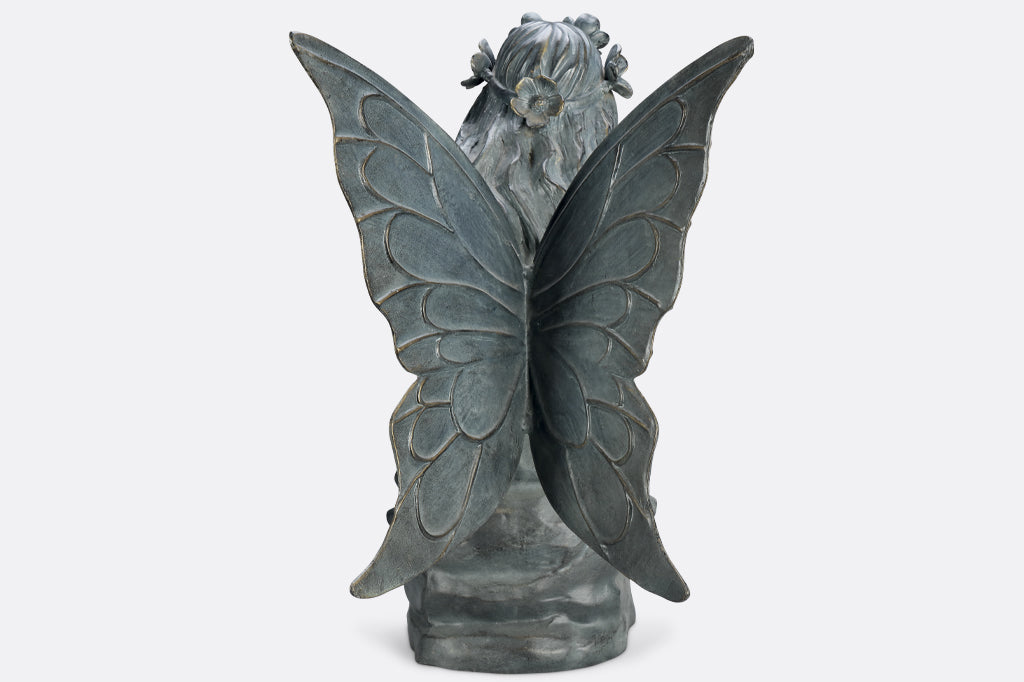back view of seated fairy garden sculpture, wings outstretched