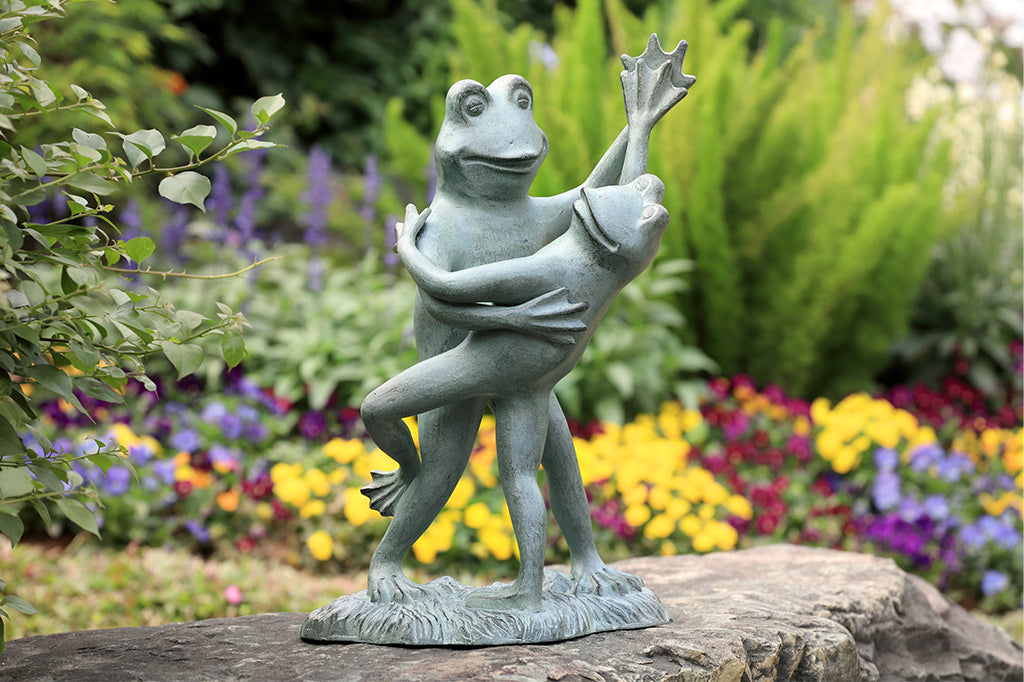 Dancing frog sculpture set in garden
