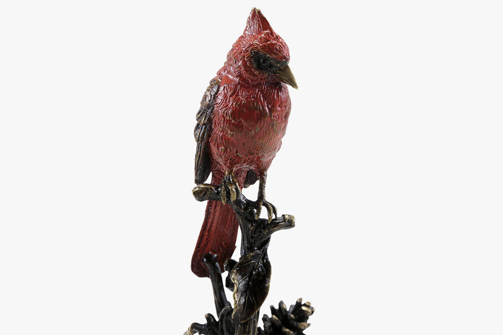 Brass sculpture of cardinal on branch