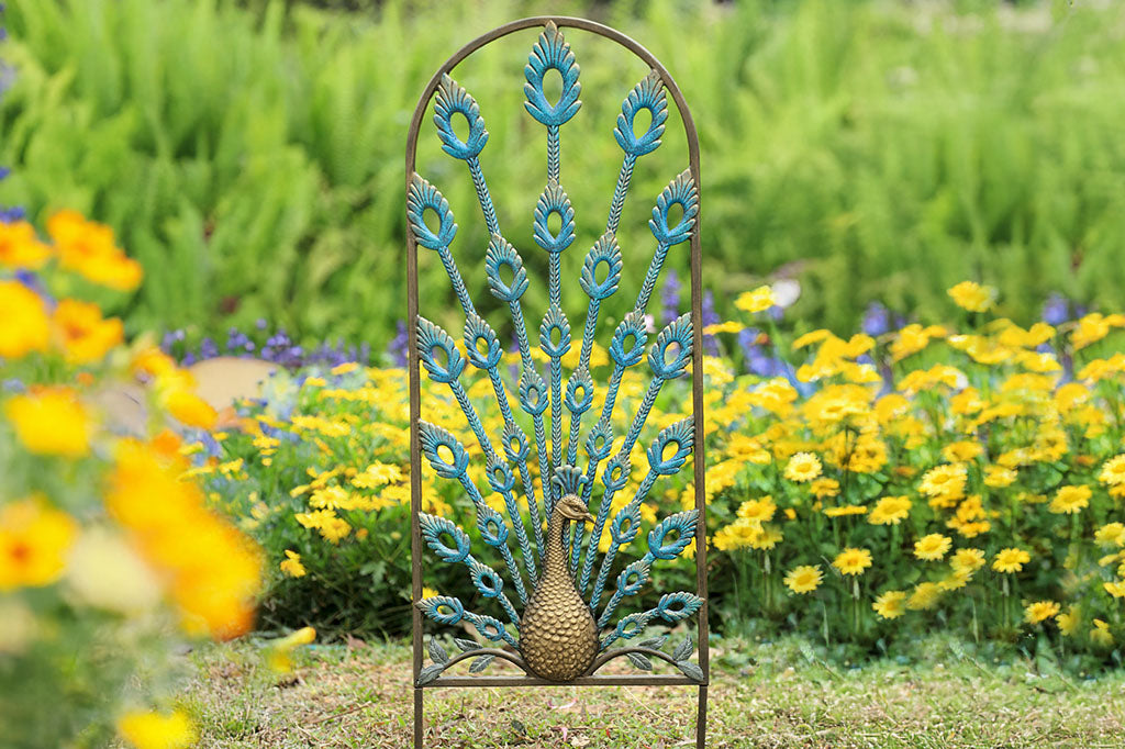 Peacock themed trellis with feathers providing radiating support. Finished in blues and golds.