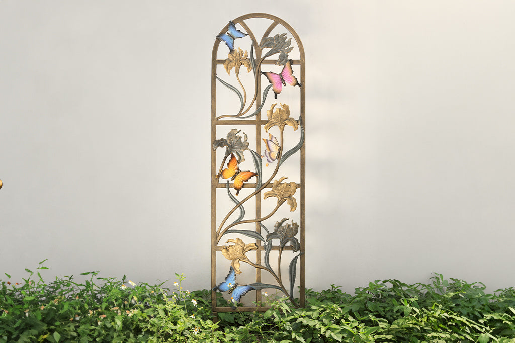 cast metal arched garden trellis with panels and iris and colorful butterflies fluttering about