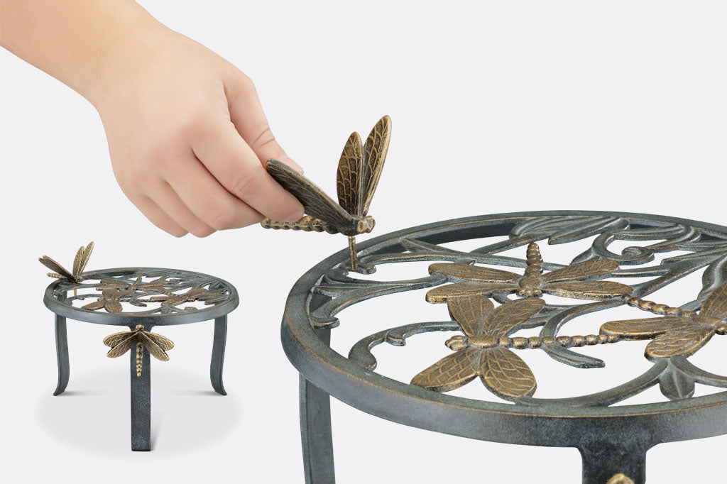 cast metal plant stand set of two, dragonflies and foliage stands with removable dragonfly details on legs of plant stand.