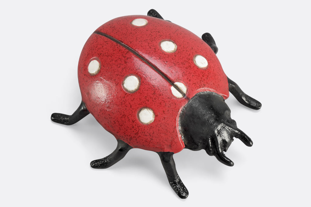 speckled red lady bug garden sculpture