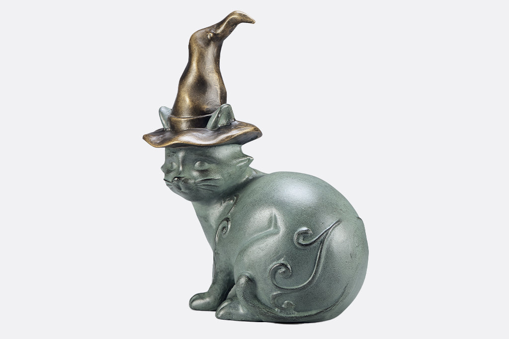 cast metal cat wearing witch hat garden sculpture
