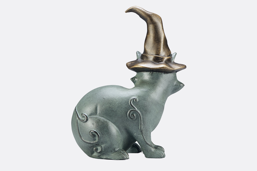 cast metal cat wearing witch hat garden sculpture