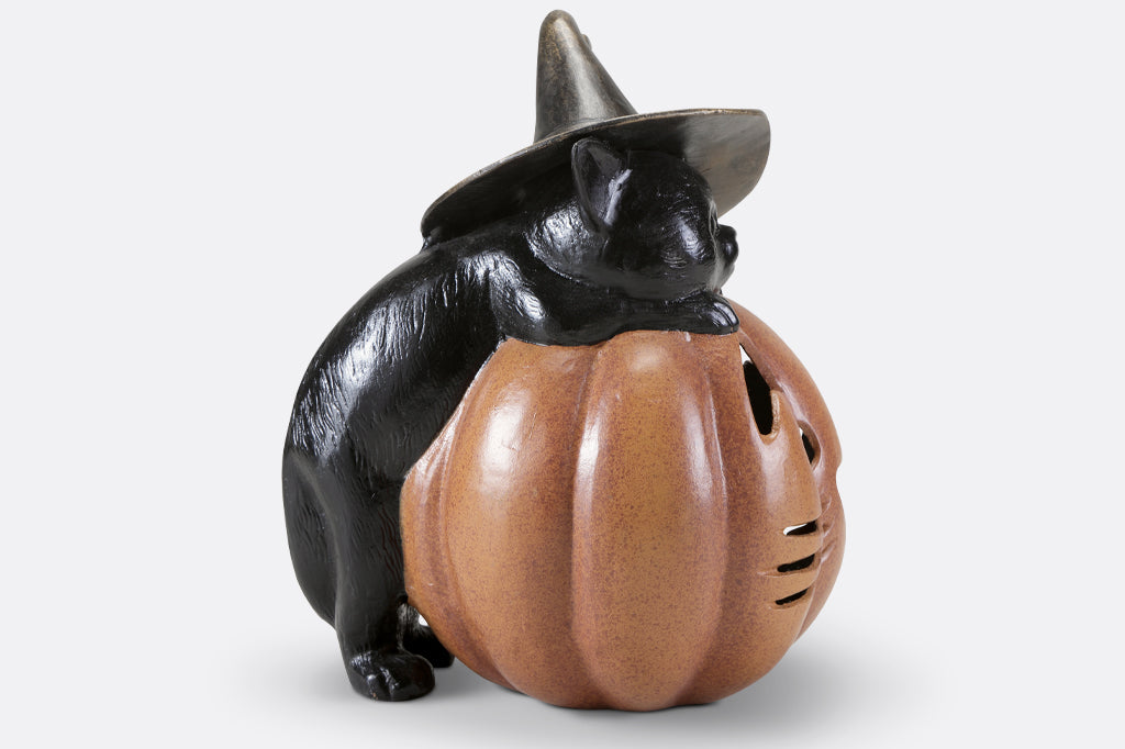 black cat with witch hat hugging a orange cat jack o lantern pumpkin cast metal lantern side profile