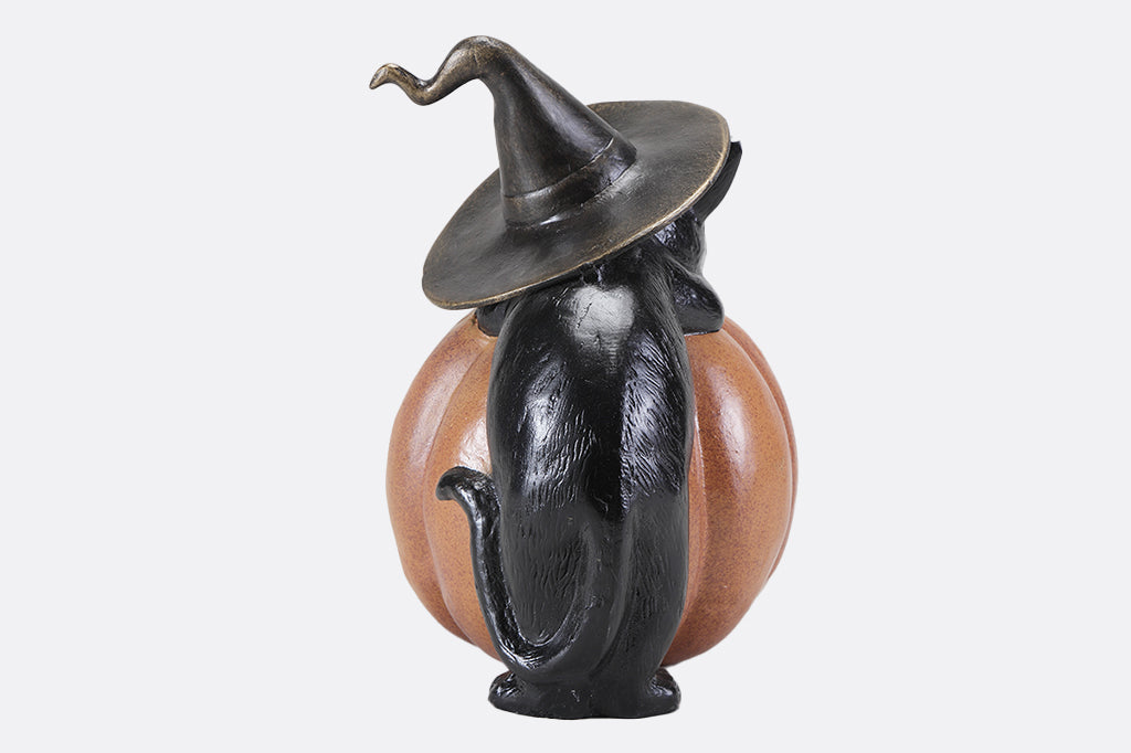black cat with witch hat hugging a orange cat jack o lantern pumpkin cast metal lantern back view
