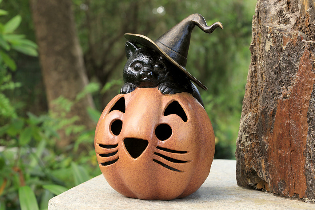 black cat with witch hat hugging a orange cat jack o lantern pumpkin cast metal lantern