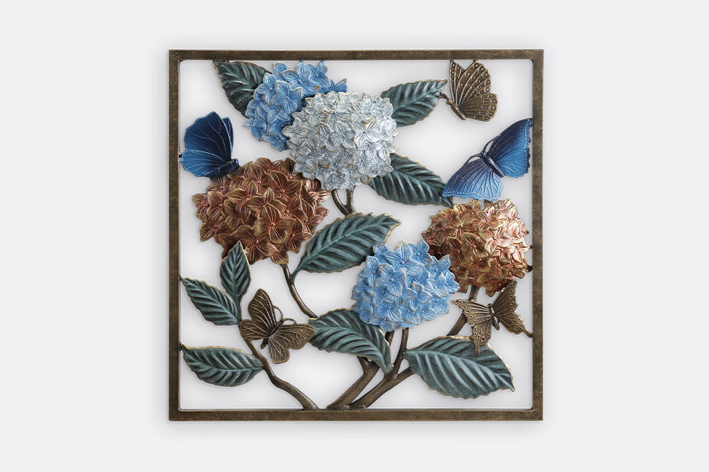 Wall plaque features hydrangea blossoms, butterflies and green leaves.
