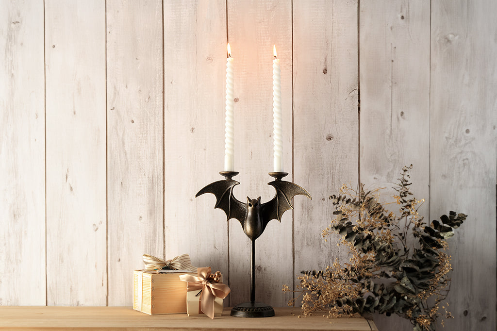 Cast metal bat tapper candle holder, with two twisted tappers light