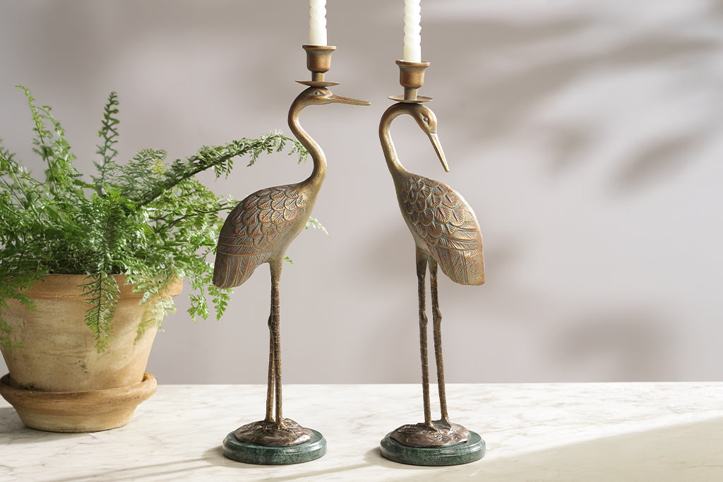 cast metal crane taper candleholders with marble base