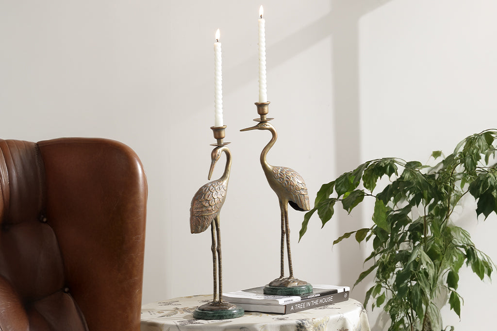 cast metal crane taper candleholders with marble base