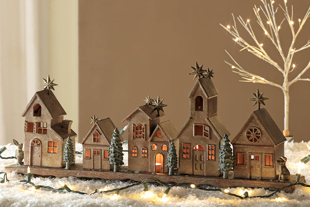 Cast metal holiday village house set of five, with small whimsical animals on side