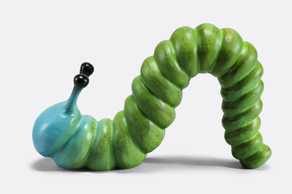 cast metal caterpillar with two antenna, colored in a lime green fading to a sky blue towards the head of caterpillar