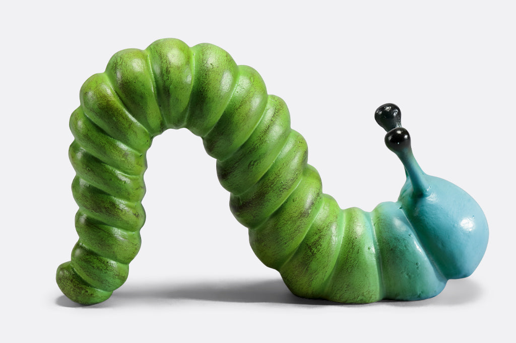 cast metal caterpillar with two antenna, colored in a lime green fading to a sky blue towards the head of caterpillar