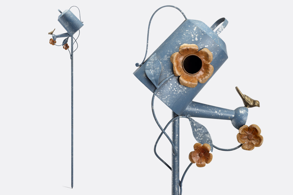 blue sheet metal watering can with bird on spout and floral details birdhouse