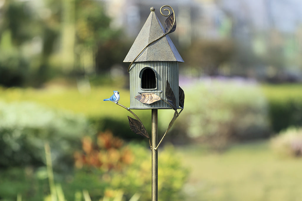 cast metal birdhouse with blue jay detailing, cottage fairy tale style home