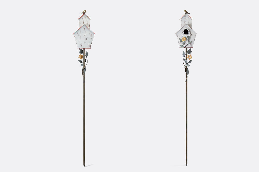 back and front views of decorative Iron birdhouse on stake, looks like rustic barn, accented with vining flowers and bird on roof