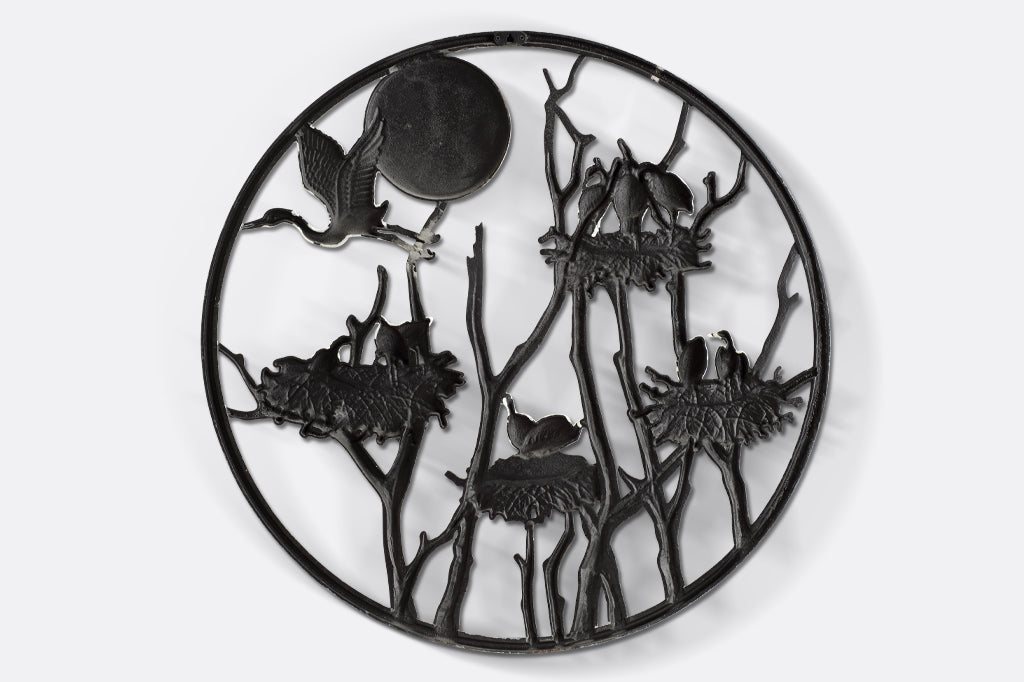 Back of wall plaque, circle in shape with one hanging bracket