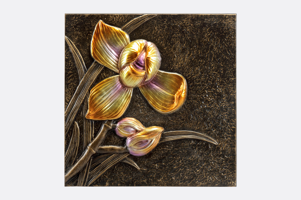Wall plaque features metallic yellow orchid and bud