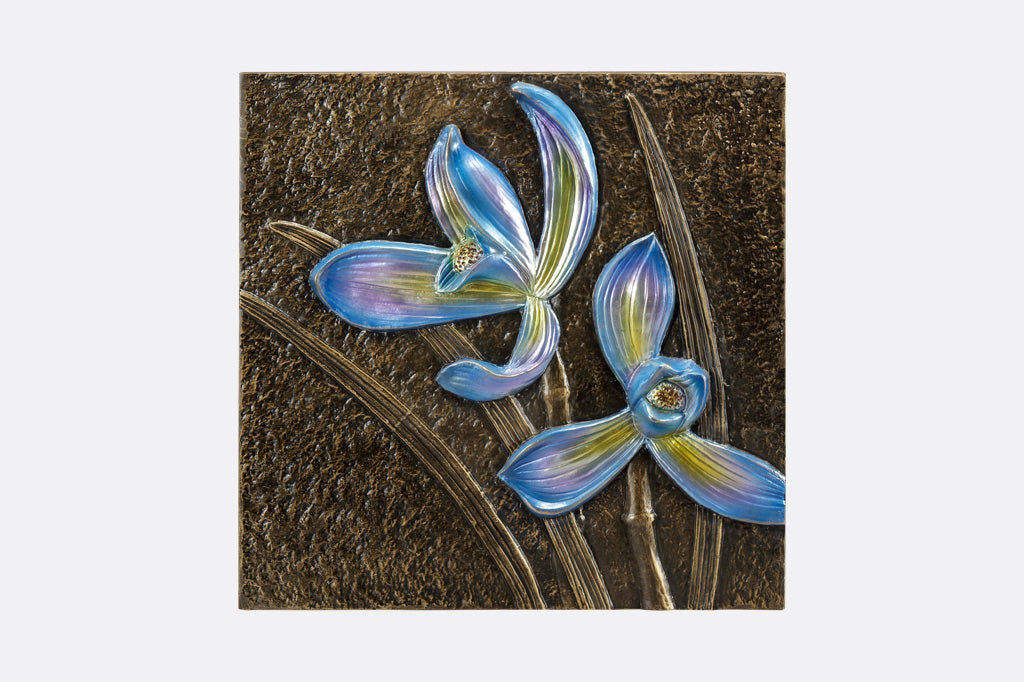 Decorative wall tile with metallic orchid motifs in blue