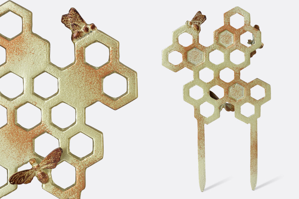 back of honeycomb planter trellis Close up view of metal finish. metallic light yellow with honey colored speckling