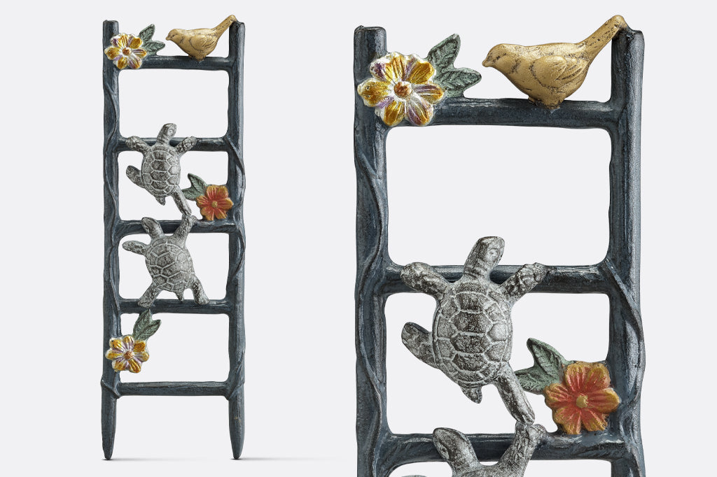 cast aluminum pot trellis featuring two turtles climbing on a flower vine ladder in pot