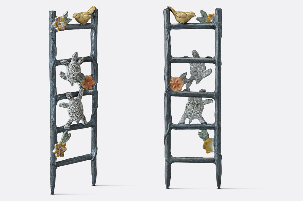 cast aluminum pot trellis featuring two turtles climbing on a flower vine ladder in pot