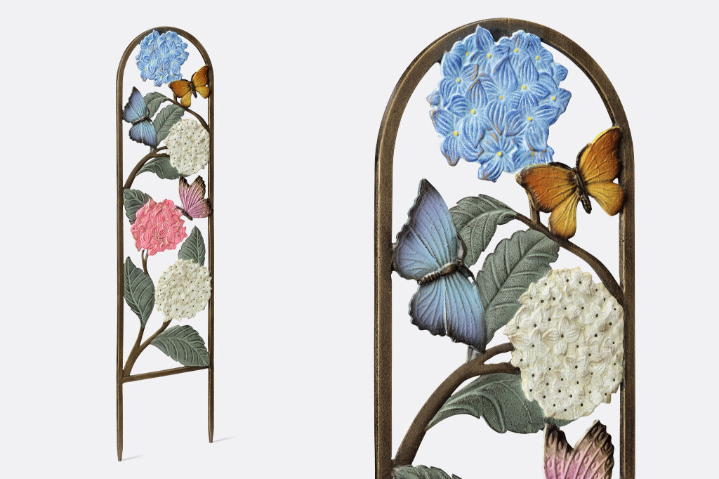multi-color hydrangea and butterfly garden trellis set in garden bed