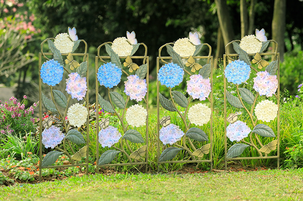 4 Garden trellises displayed side-by-side; each with colored finish on both sides that features white, blue, and purple hydrangea blossoms with multi-hued butterfly accents.