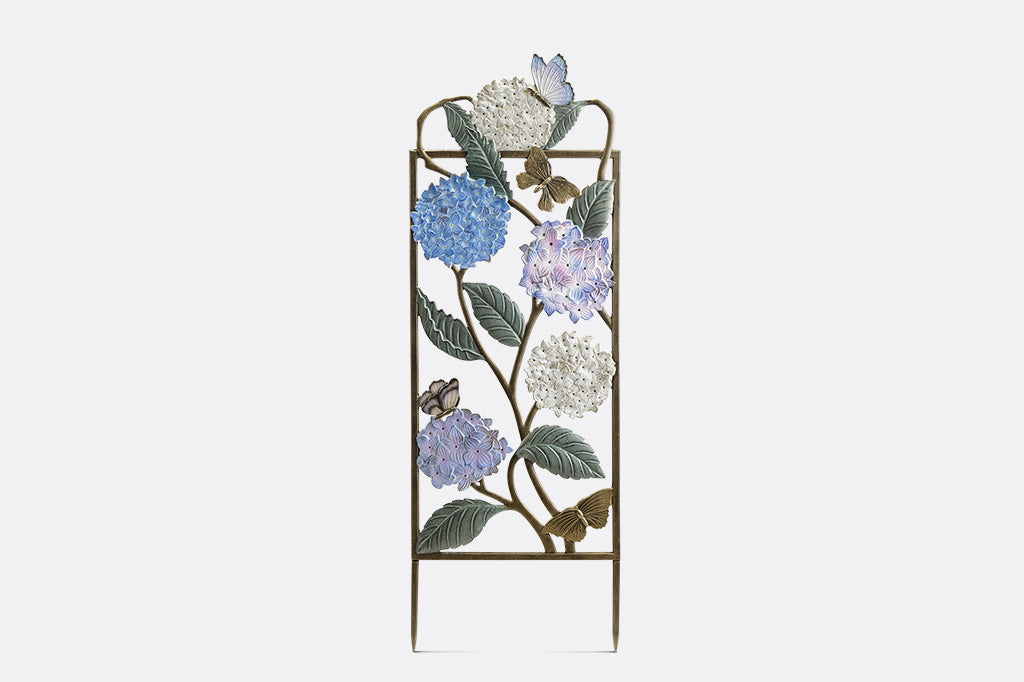 Garden trellis with colored finish on both sides, features white, blue, and purple hydrangea blossoms with multi-hued butterfly accents.