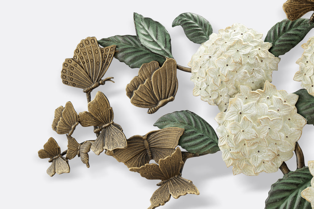 detail view of white/ hydrangeas with cream highlights and fluttering butterflies