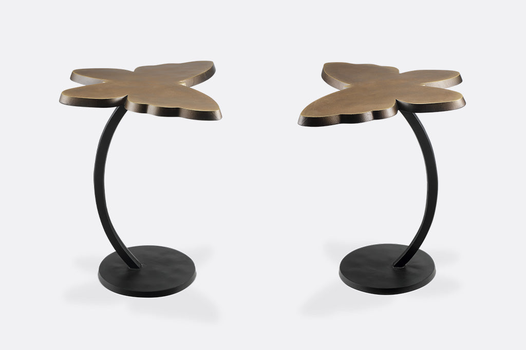 two views shown of accent table with a striking bronze butterfly silhouette