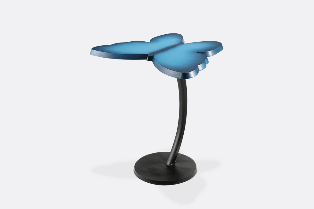animation of multiple angles of modern blue accent table with butterfly silhouette