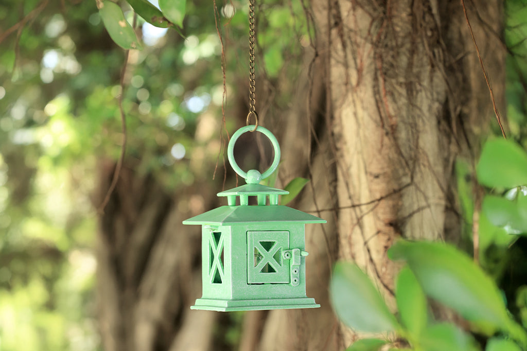 hanging mint lantern in trees #color_green