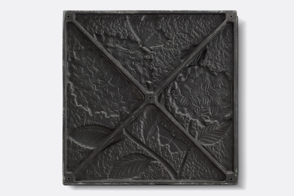 back of stepping stone, relief of hydrangea design can be seen on back